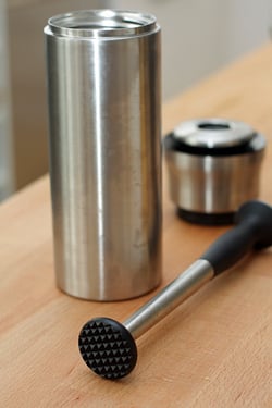 muddler and cocktail shaker