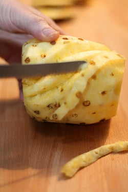 peeling pineapple