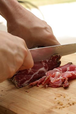 slicing charcuterie